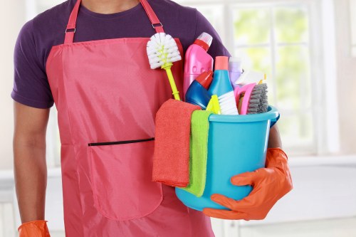 Carpet cleaning worker preparing safe equipment and workspace