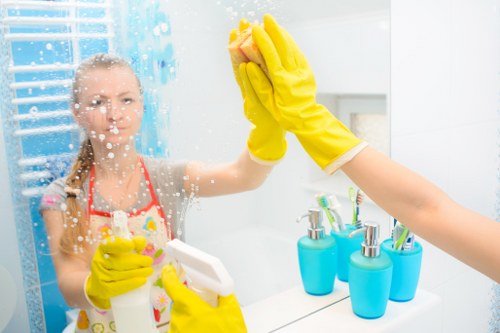 Post-construction cleaning team in TW10 polishing glass and surfaces